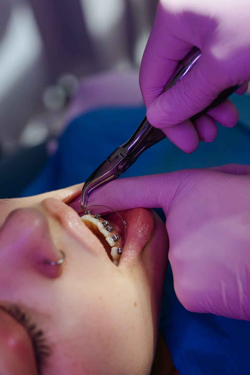 close up photo of dentist examining patient s teeth