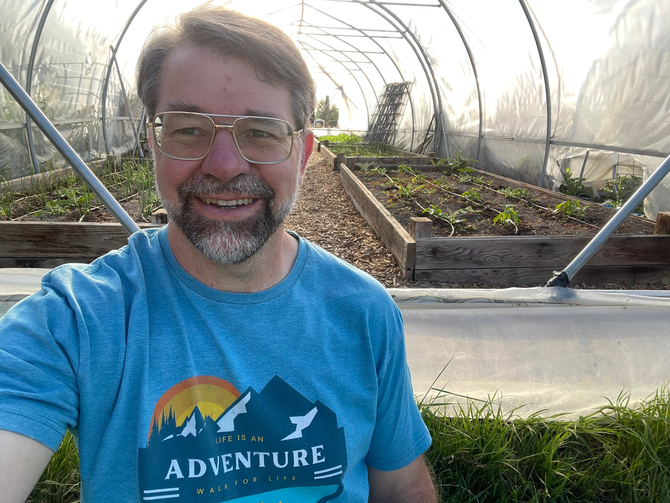 Dr. Michael Donaldson in his greenhouse garden