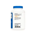 White plastic bottle with a blue cap facing forward, back label visible with small print, barcode, and nutrition information